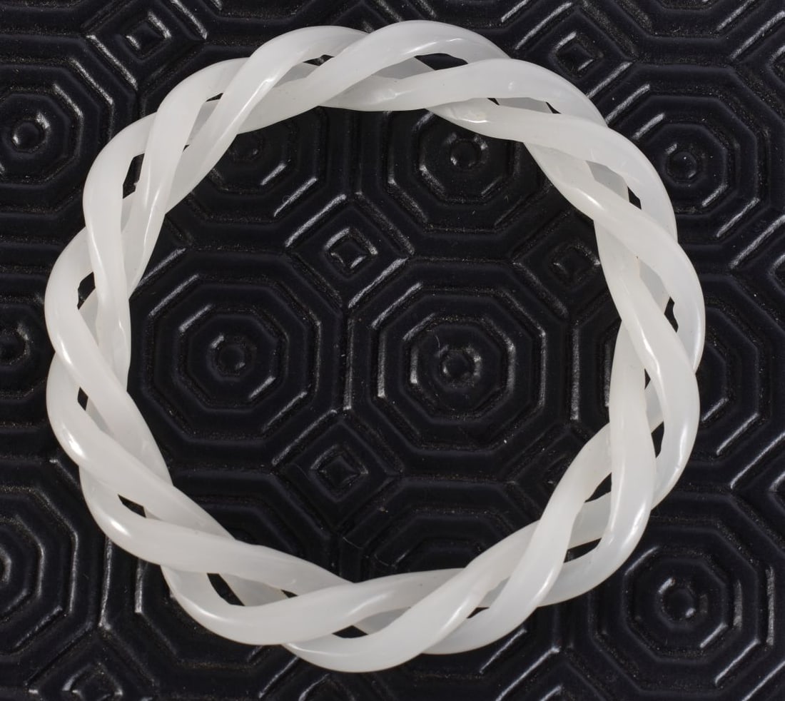 A CHINESE WHITE JADE RETICULATED BANGLE. 25 grams. 6 cm wide. (1 of 3)