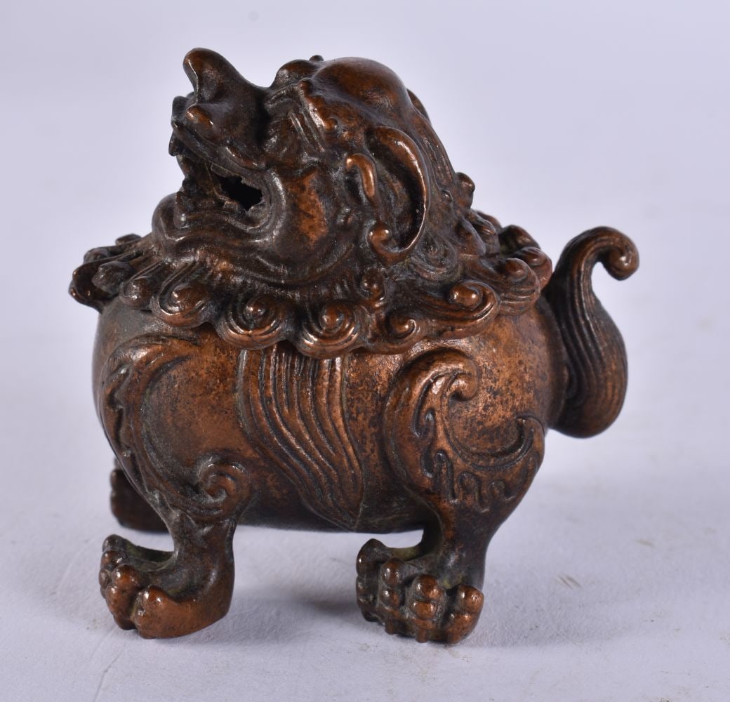 A JAPANESE BRONZE FOO DOG CENSER. 145 grams. 6 cm x 5.75 cm. (1 of 4)