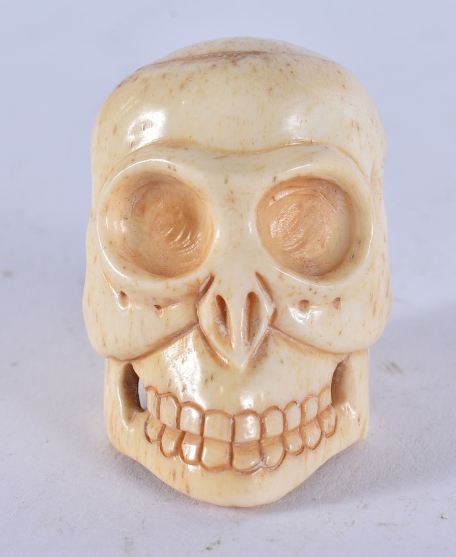A JAPANESE BONE SKULL. 26 grams. 4.5 cm x 3.5 cm. (1 of 4)
