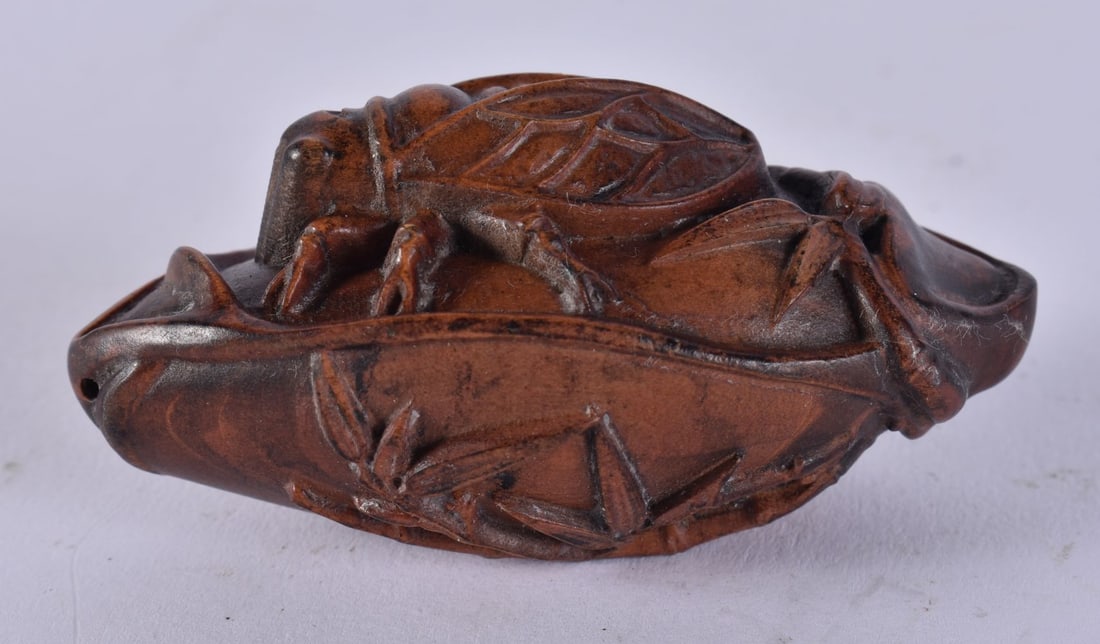 A JAPANESE CARVED WOOD CICADA. 24 grams. 7 cm x 3.5 cm. (1 of 4)