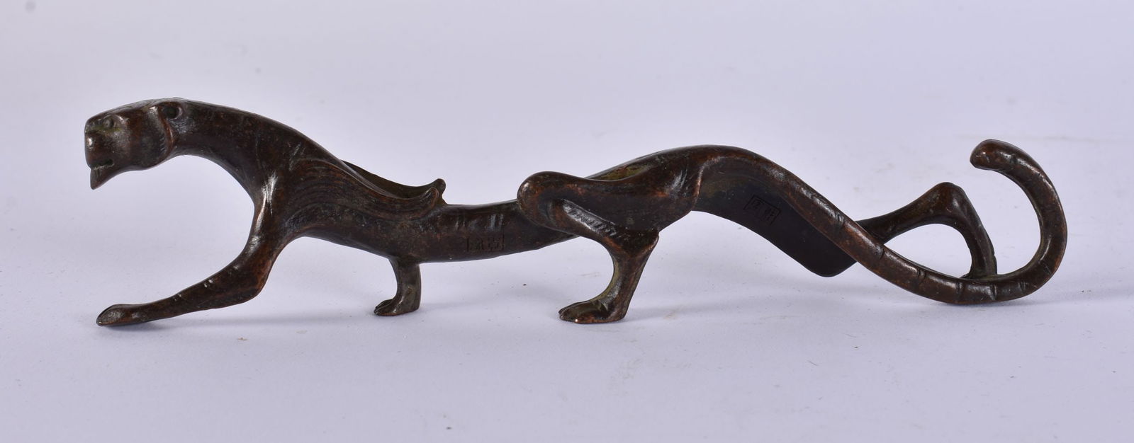 A JAPANESE BRONZE SCROLL WEIGHT. 168 grams. 18 cm wide. (1 of 4)