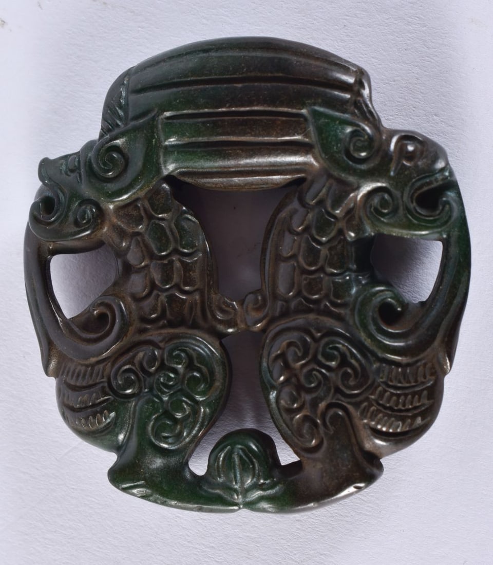 A CHINESE JADE ROUNDEL. 40.5 grams. 5.5 cm wide. (1 of 2)