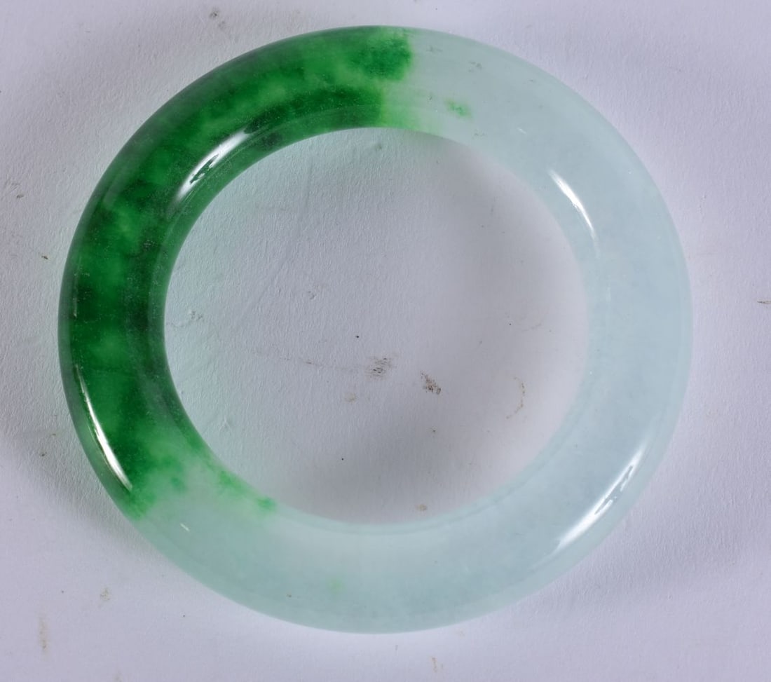 A CHINESE JADE BANGLE. 99.9 grams. 6 cm wide. (1 of 4)