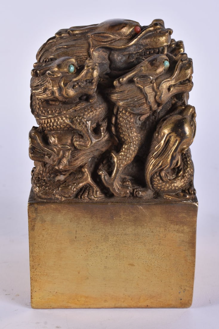 A CHINESE BRONZE DRAGON SEAL. 14 cm high. (1 of 6)