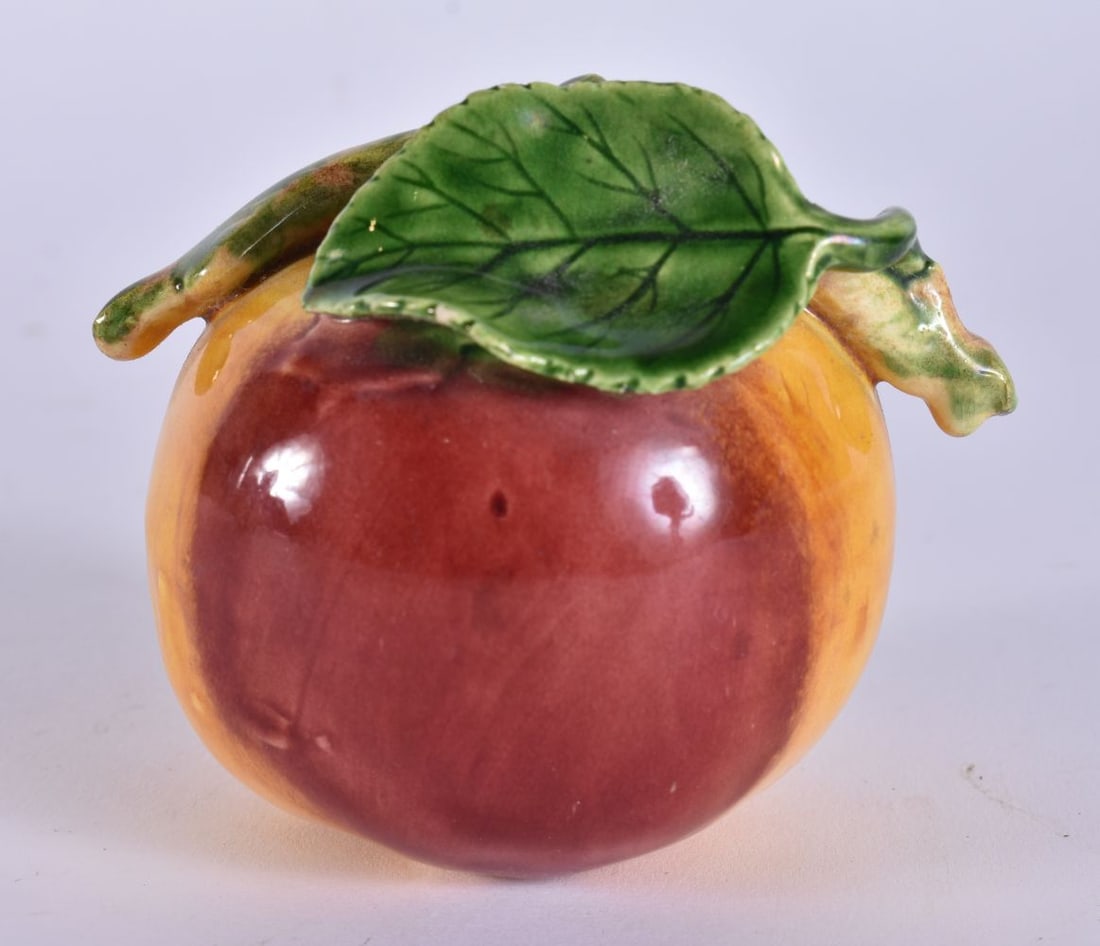 A CHINESE PORCELAIN PEACH. 8.5 cm wide. (1 of 4)