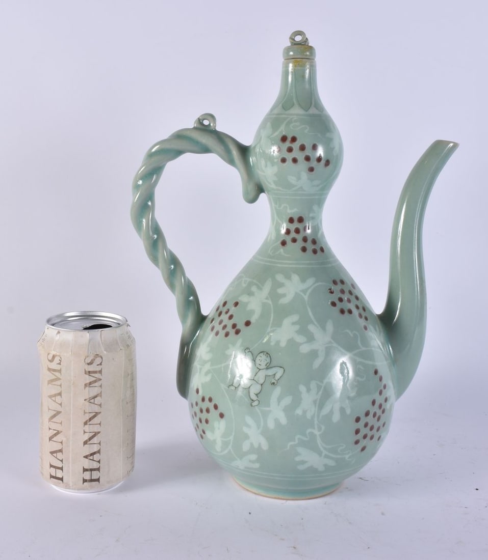 A KOREAN CELADON EWER. 32 cm high. (1 of 4)