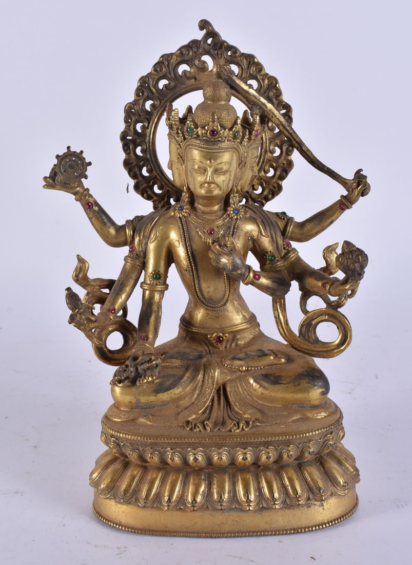 A CHINESE GILT BRONZE TIBETAN BUDDHA. 25 cm x 10 cm. (1 of 3)