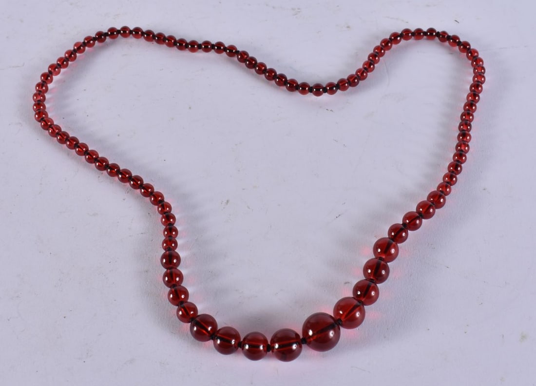 A CHERRY BEAD NECKLACE. 44 grams. 70 cm long. (1 of 3)