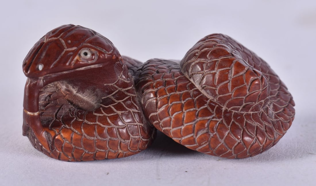 A JAPANESE WOOD SNAKE NETSUKE 14.5 grams. 5.25 cm x 2.75 cm. (1 of 4)