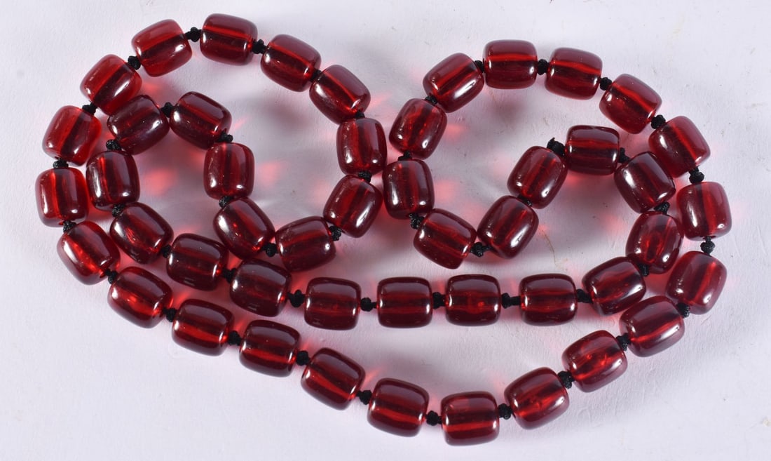 A CHERRY BEAD NECKLACE. 57 grams. 72 cm long. (1 of 3)