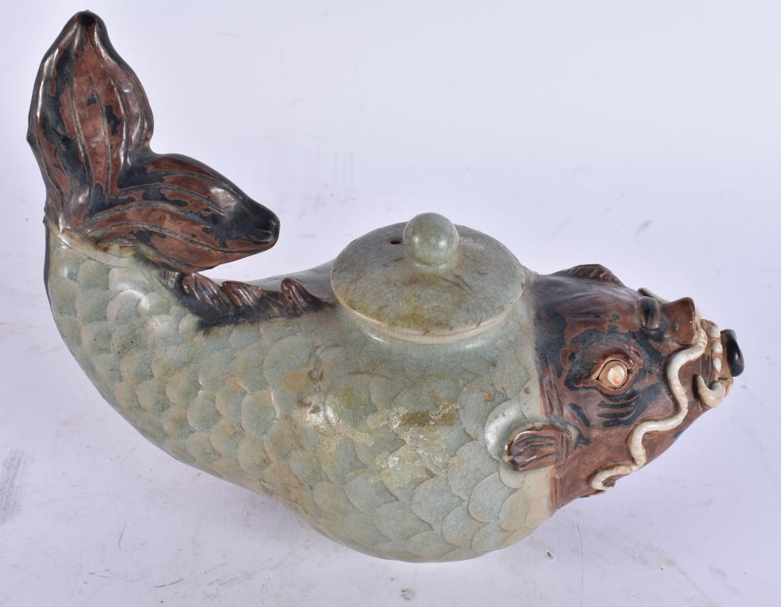 AN UNUSUAL KOREAN POTTERY FISH CENSER AND COVER. 21 cm wide. (1 of 4)
