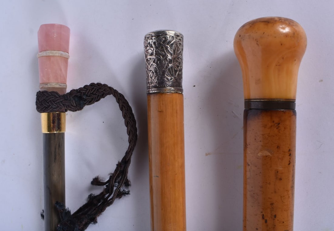 Two walking canes one with an embossed silver handle together with a vintage parasol 83cm (3) (1 of 3)