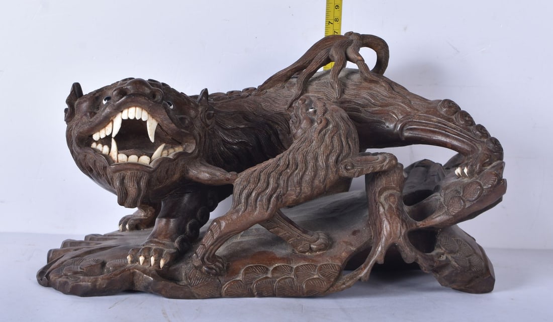 A large Japanese hardwood carving of a Mythical beast 18 x 32cm (1 of 6)