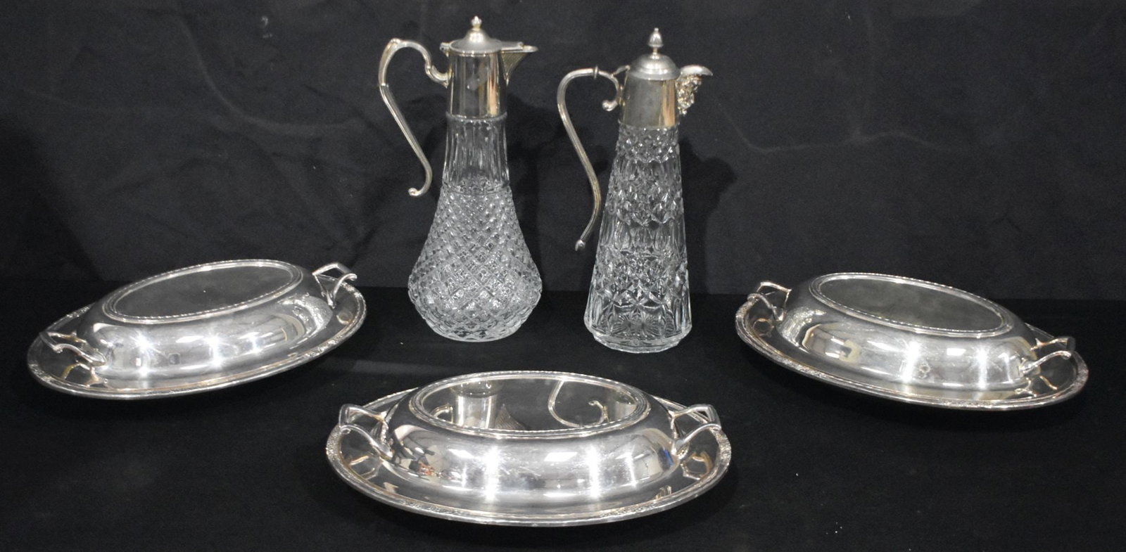 Two silver plate and lead crystal Claret jugs together with a collection of plate serving dishes 29. (1 of 6)