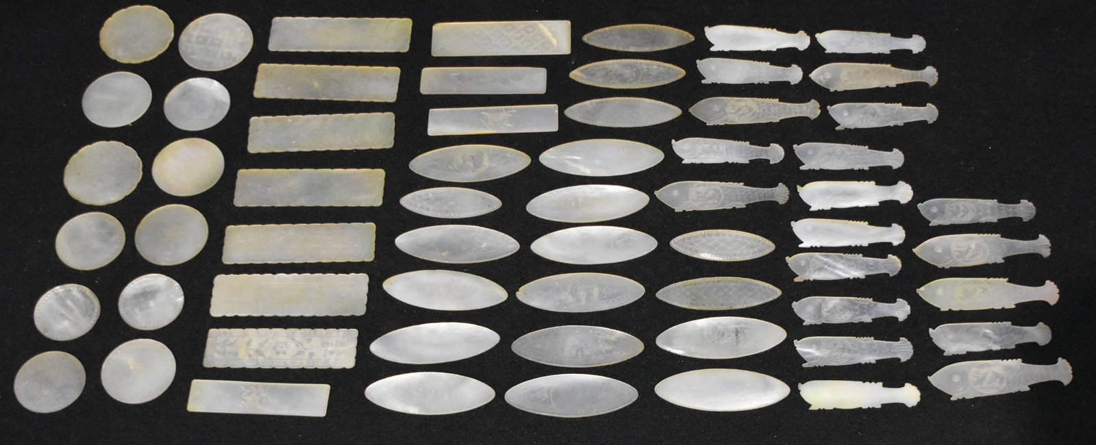 A collection of Chinese Mother of pearl gaming counters 6 x 2cm (62 ): A collection of Chinese Mother of pearl gaming counters 6 x 2cm (62 )