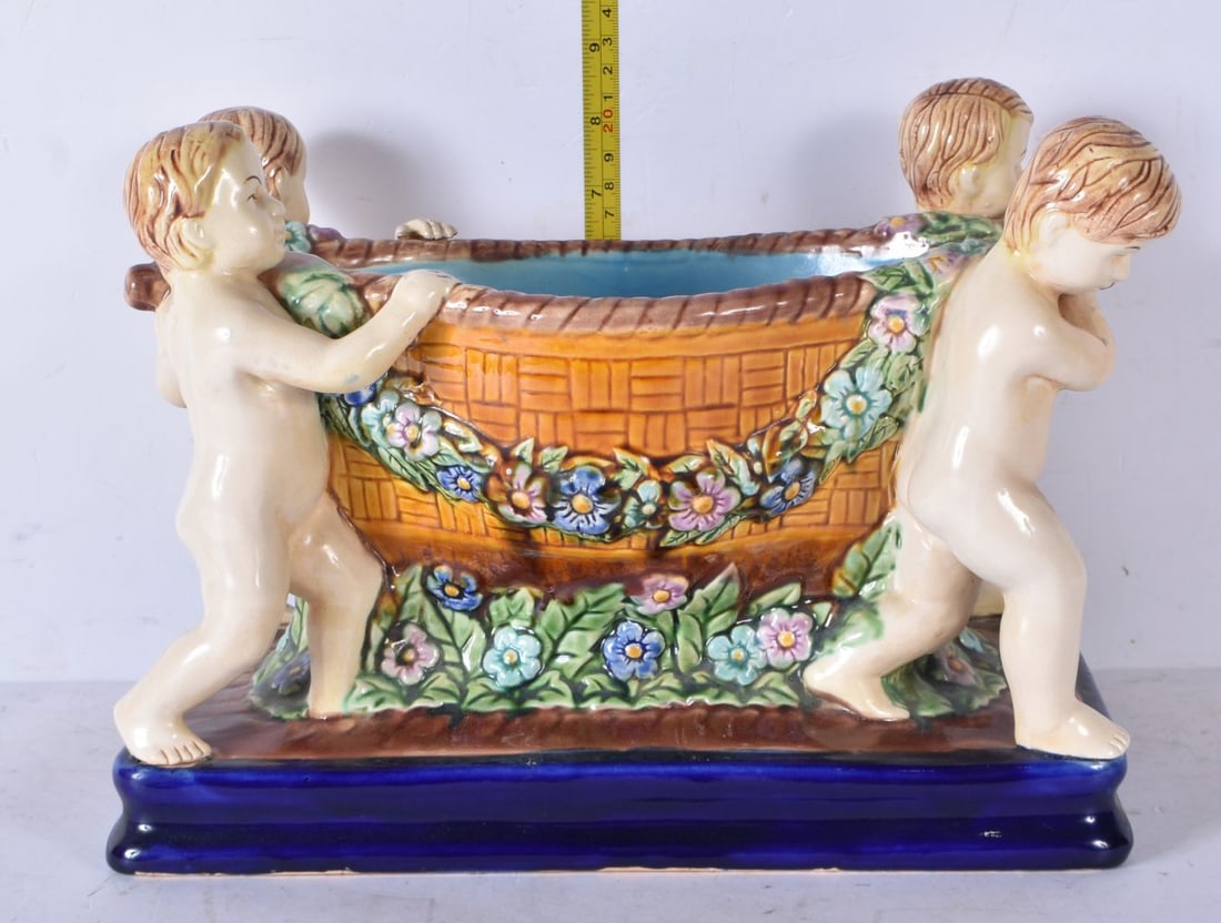 A Continental Majolica cherub planter 22 x 30 x 16cm (1 of 4)