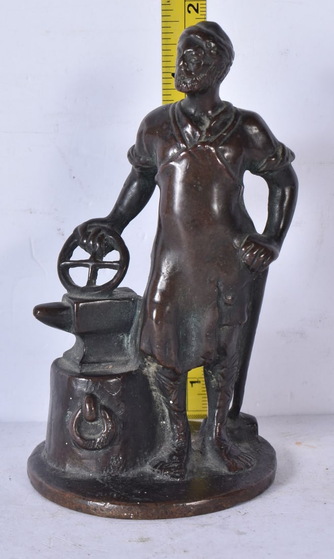 An antique small bronze figure of a blacksmith 12.5cm (1 of 3)