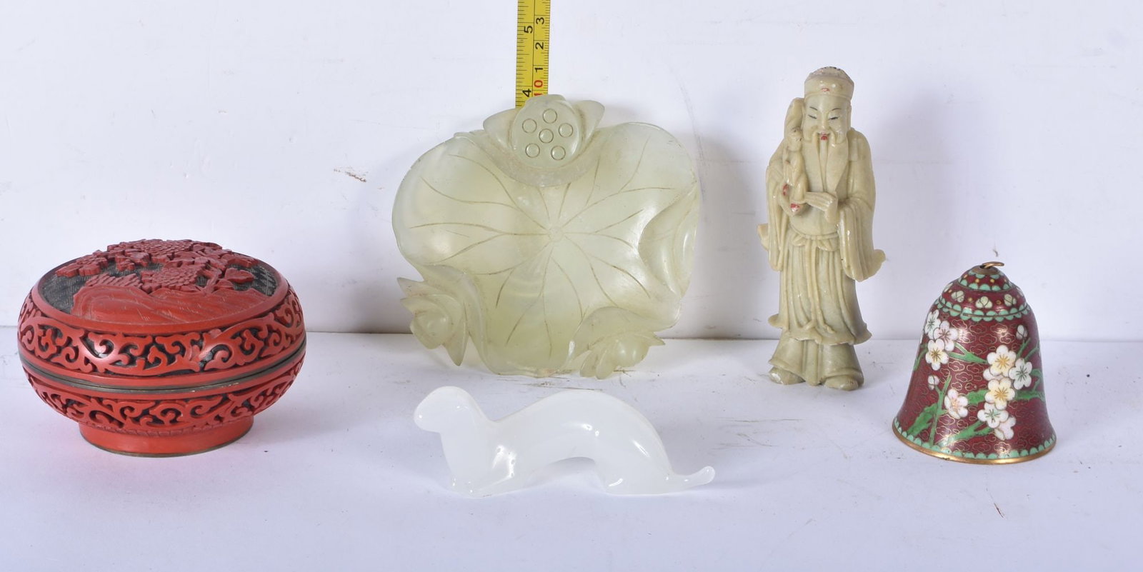 A Chinese Cinnabar lidded pot together with soapstone figure, cloisonne bell , bone and glass items (1 of 7)