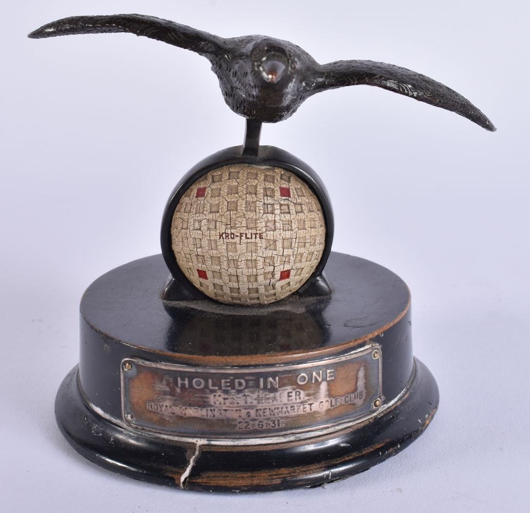 AN UNUSUAL ART DECO BRONZE AND SILVER PLATED GOLFING HOLE IN ONE TROPHY presented by Spalding to Mrs: AN UNUSUAL ART DECO BRONZE AND SILVER PLATED GOLFING HOLE IN ONE TROPHY presented by Spalding to Mrs Leader (Newmarket golf club). 12 cm x 10 cm.
