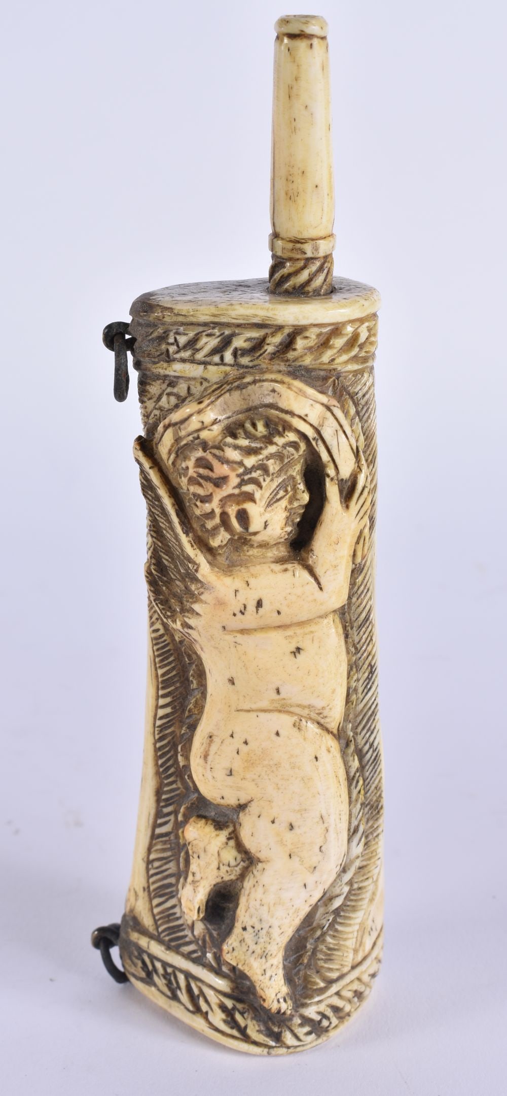 A RARE EARLY 19TH CENTURY FRENCH PRISONER OF WAR CARVED BONE POWDER FLASK formed with a putti. 15.5: A RARE EARLY 19TH CENTURY FRENCH PRISONER OF WAR CARVED BONE POWDER FLASK formed with a putti. 15.5 cm high.