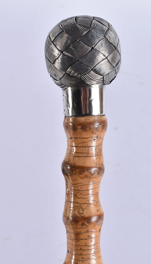 AN ANTIQUE SILVER SAILORS KNOT WALKING CANE. 88 cm long.: AN ANTIQUE SILVER SAILORS KNOT WALKING CANE. 88 cm long.