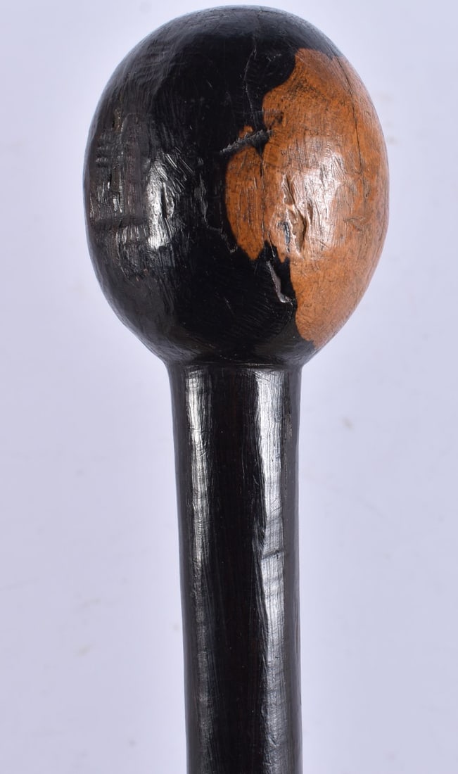 AN AFRICAN TRIBAL LIGNUM VITAE WOOD WALKING CANE. 90 cm long.: AN AFRICAN TRIBAL LIGNUM VITAE WOOD WALKING CANE. 90 cm long.