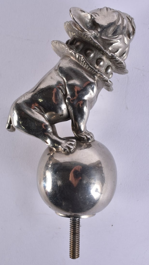 A RARE ART DECO FRENCH BULLDOG CAR RADIATOR MASCOT modelled in a double ruffled collar. 15.5 cm long: A RARE ART DECO FRENCH BULLDOG CAR RADIATOR MASCOT modelled in a double ruffled collar. 15.5 cm long inc thread.