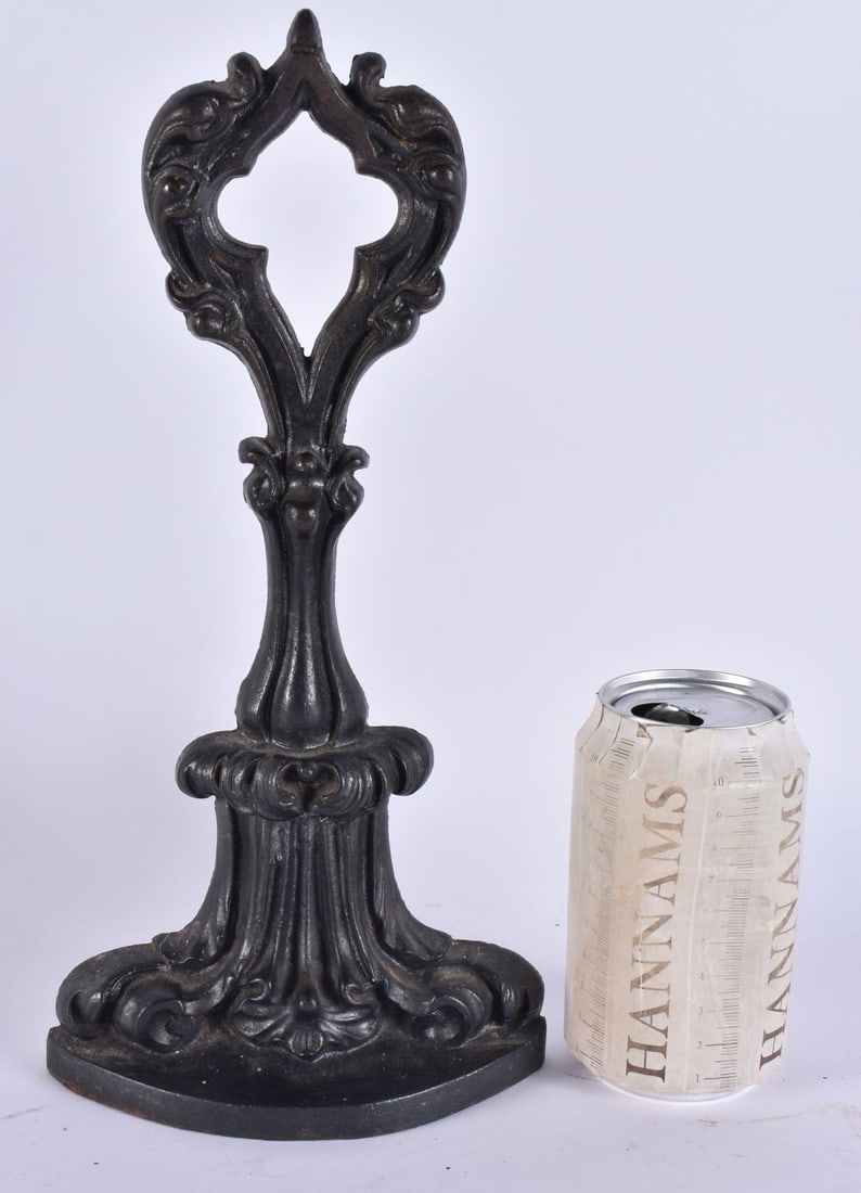 A VICTORIAN CAST IRON A K & SONS DOOR STOP. 29 cm x 12 cm. (1 of 4)