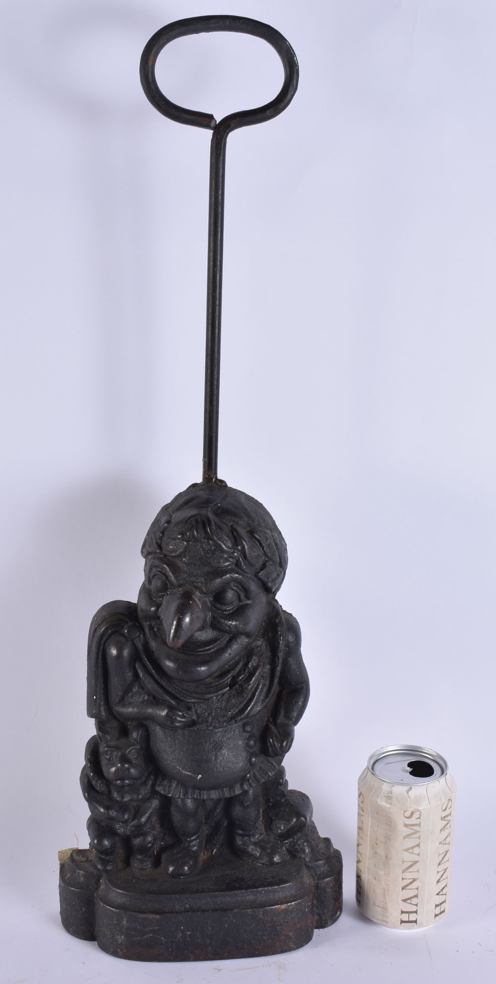 A VICTORIAN CAST IRON PUNCH DOOR STOP. 54cm x 14cm. (1 of 4)