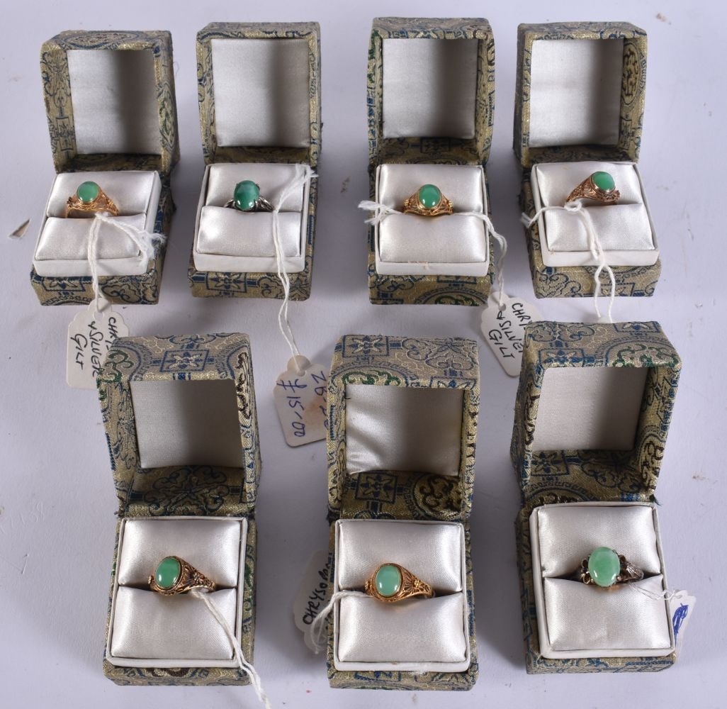 SEVEN CHINESE SILVER AND GREEN CHRYSOPRASE RINGS in various forms and sizes. (7): SEVEN CHINESE SILVER AND GREEN CHRYSOPRASE RINGS in various forms and sizes. (7)