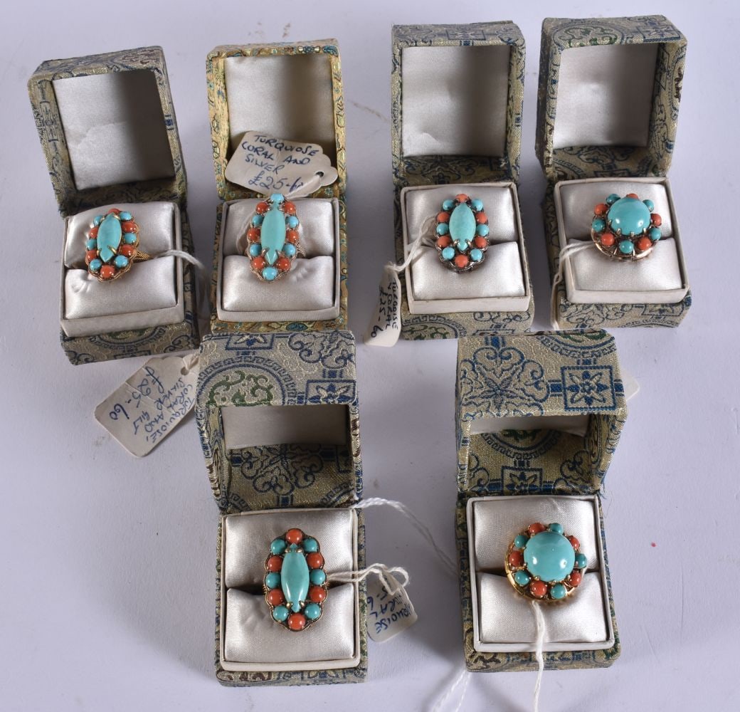 SIX CHINESE SILVER CORAL AND TURQUOISE RINGS in various forms and sizes. (7): SIX CHINESE SILVER CORAL AND TURQUOISE RINGS in various forms and sizes. (7)