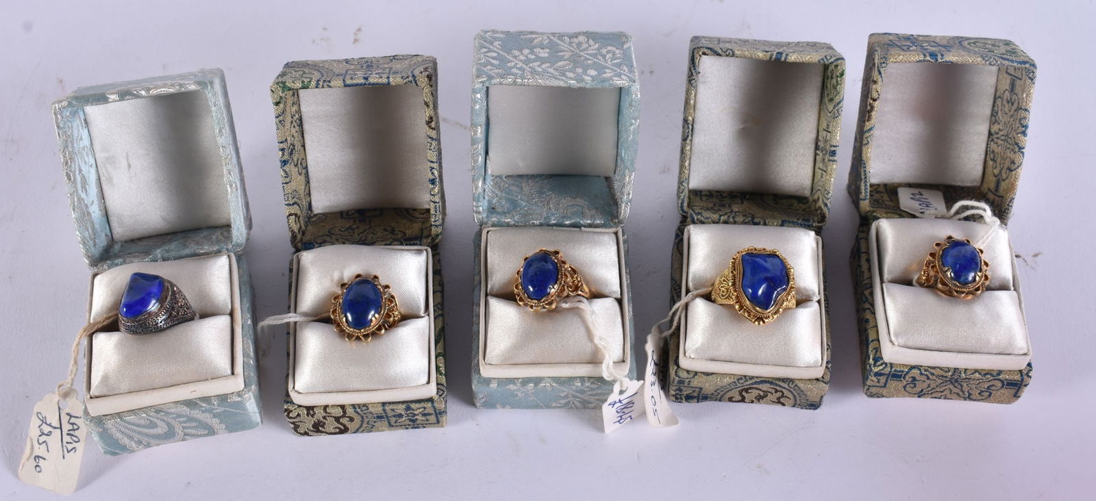 FIVE CHINESE SILVER AND LAPIS LAZULI RINGS in various forms and sizes. (5): FIVE CHINESE SILVER AND LAPIS LAZULI RINGS in various forms and sizes. (5)