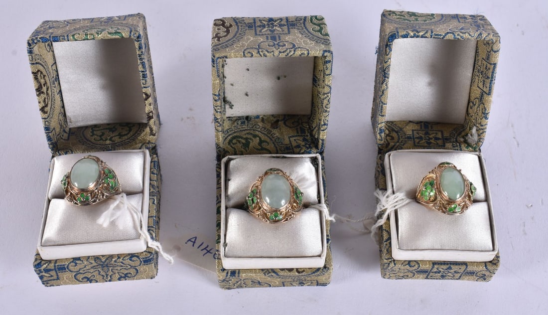 THREE CHINESE SILVER ENAMEL AND JADE RINGS in various forms and sizes. (3): THREE CHINESE SILVER ENAMEL AND JADE RINGS in various forms and sizes. (3)