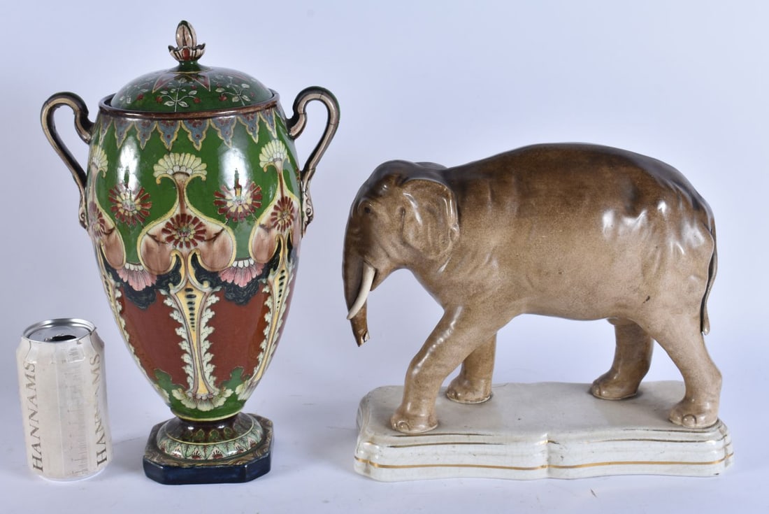 AN UNUSUALLY LARGE 19TH CENTURY STAFFORDSHIRE POTTERY FIGURE OF JUMBO THE ELEPHANT together with an (1 of 5)