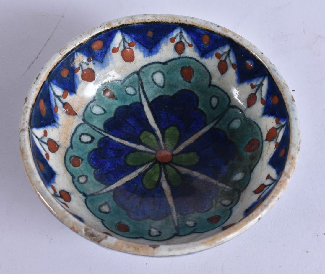 A MIDDLE EASTERN PALESTINE IZNIK POTTERY BOWL painted with flowers. 12 cm wide. (1 of 4)