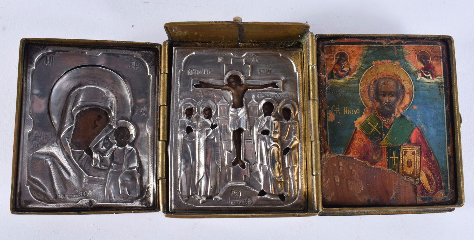 A FINE 19TH CENTURY RUSSIAN SILVER MOUNTED BRONZE TRIPTYCH ICON. 257 grams. 18 cm wide extended.: A FINE 19TH CENTURY RUSSIAN SILVER MOUNTED BRONZE TRIPTYCH ICON. 257 grams. 18 cm wide extended.