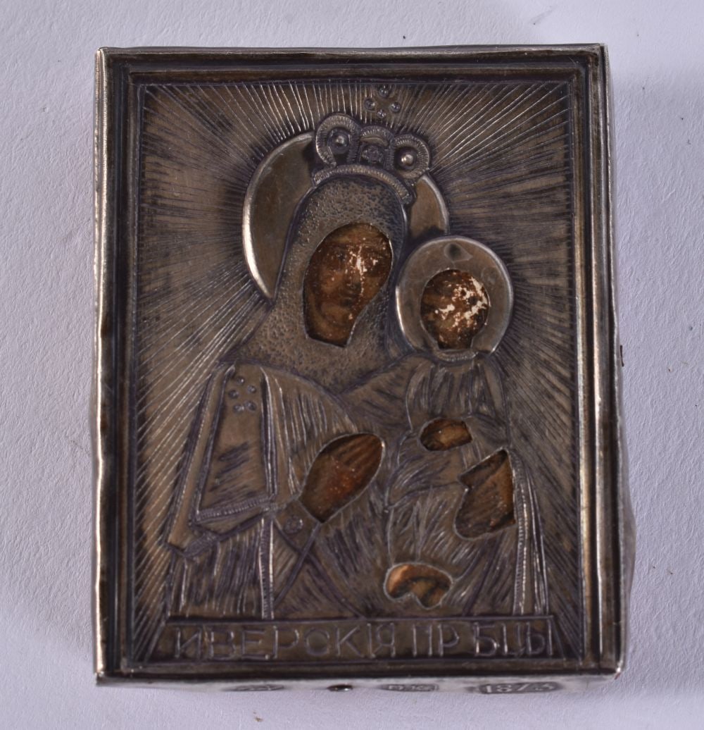 A 19TH CENTURY RUSSIAN SILVER MOUNTED WOOD ICON. 12.1 grams. 5.25 cm x 4.25 cm.: A 19TH CENTURY RUSSIAN SILVER MOUNTED WOOD ICON. 12.1 grams. 5.25 cm x 4.25 cm.
