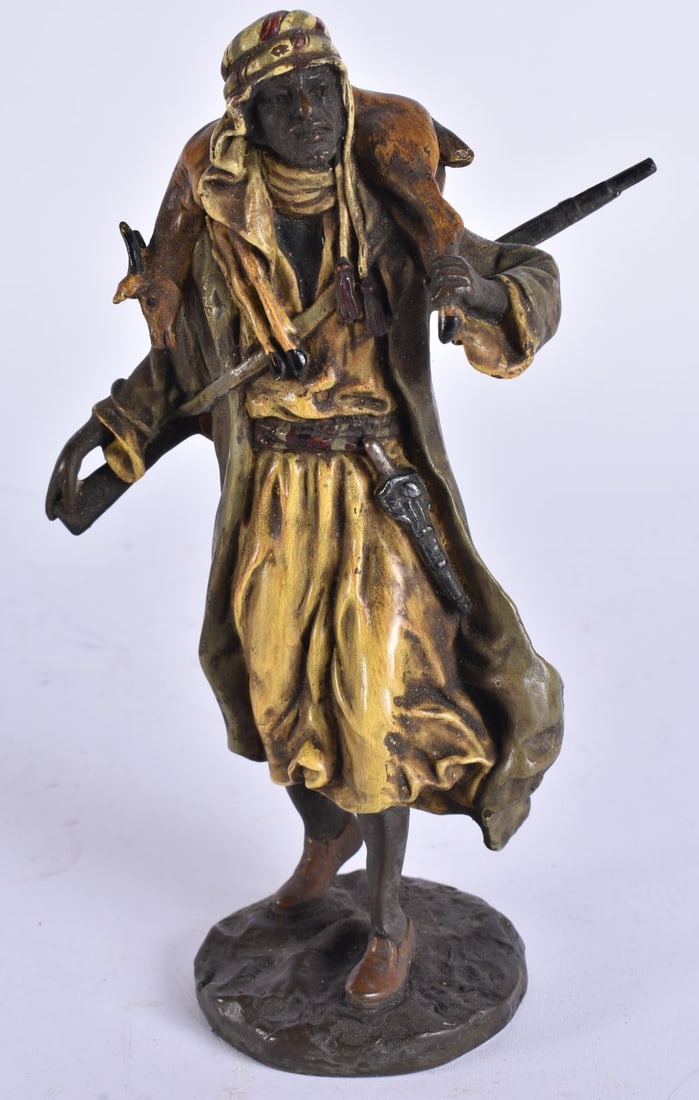 A COLD PAINTED BRONZE MIDDLE EASTERN FIGURE. 17.5 cm high.: A COLD PAINTED BRONZE MIDDLE EASTERN FIGURE. 17.5 cm high.
