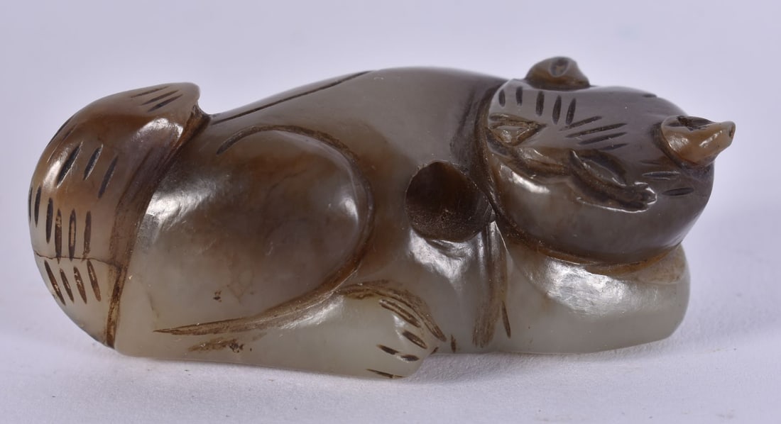 A CHINESE QING DYNASTY CARVED GREEN JADE CAT TOGGLE. 5 cm wide. (1 of 5)