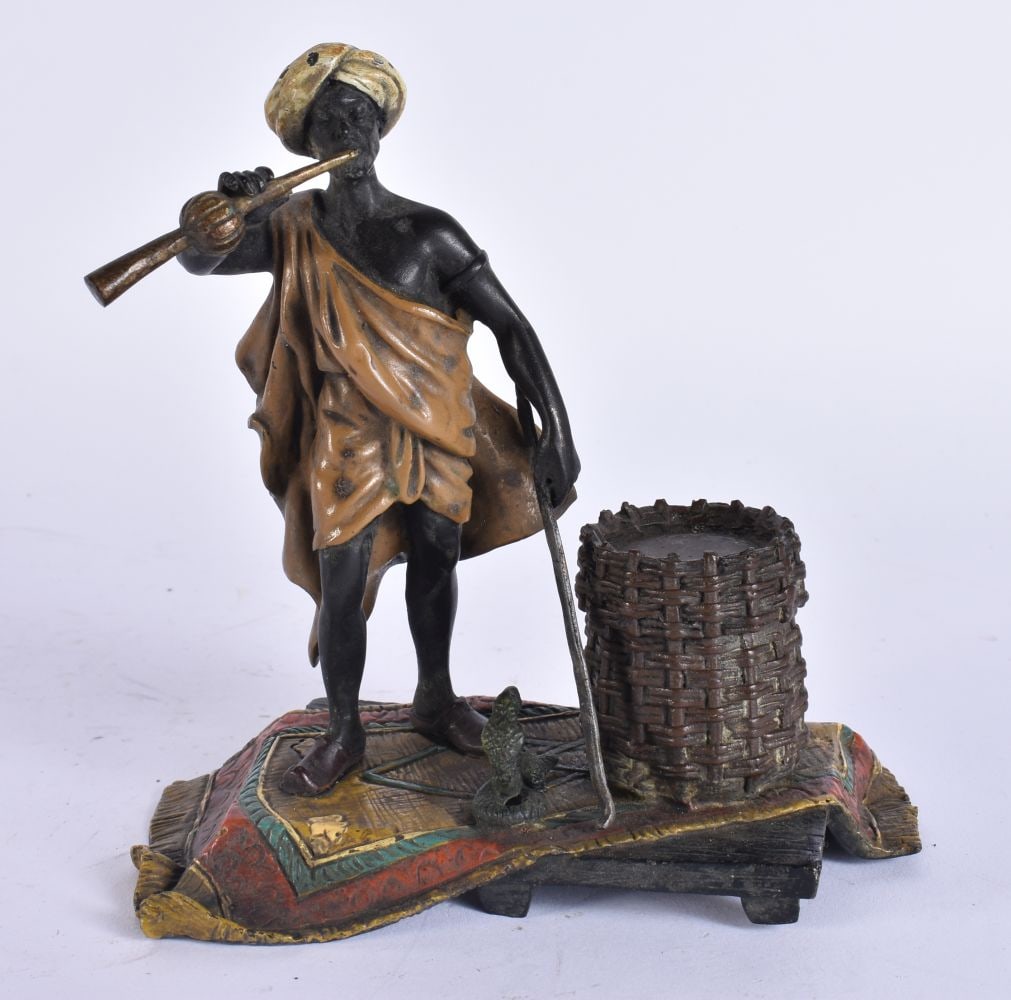A CONTINENTAL COLD PAINTED BRONZE PIPE SMOKER. 15 cm high.: A CONTINENTAL COLD PAINTED BRONZE PIPE SMOKER. 15 cm high.