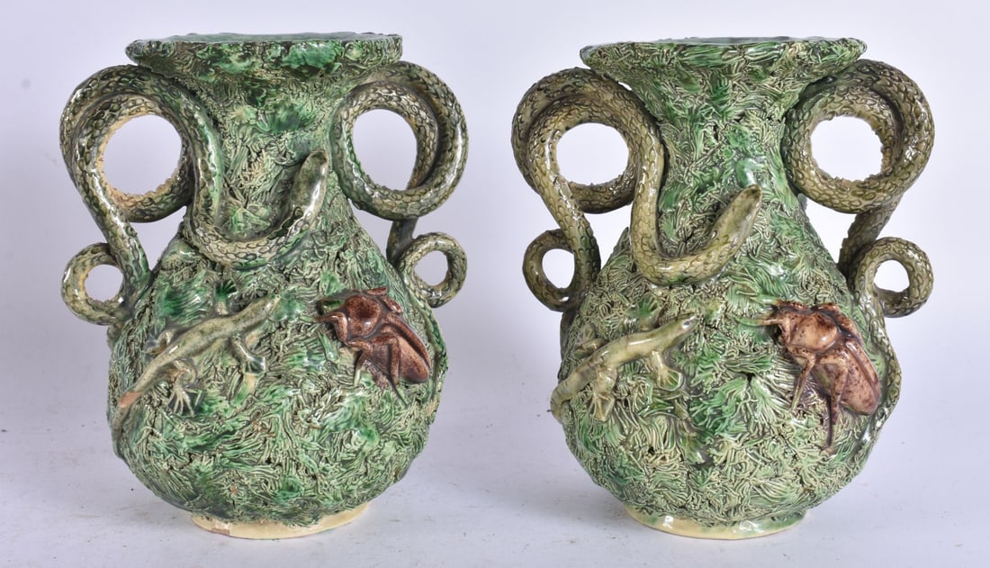 A PAIR OF 19TH CENTURY PORTUGUESE PALISSY TWIN HANDLED VASES. 16 cm high.: A PAIR OF 19TH CENTURY PORTUGUESE PALISSY TWIN HANDLED VASES. 16 cm high.