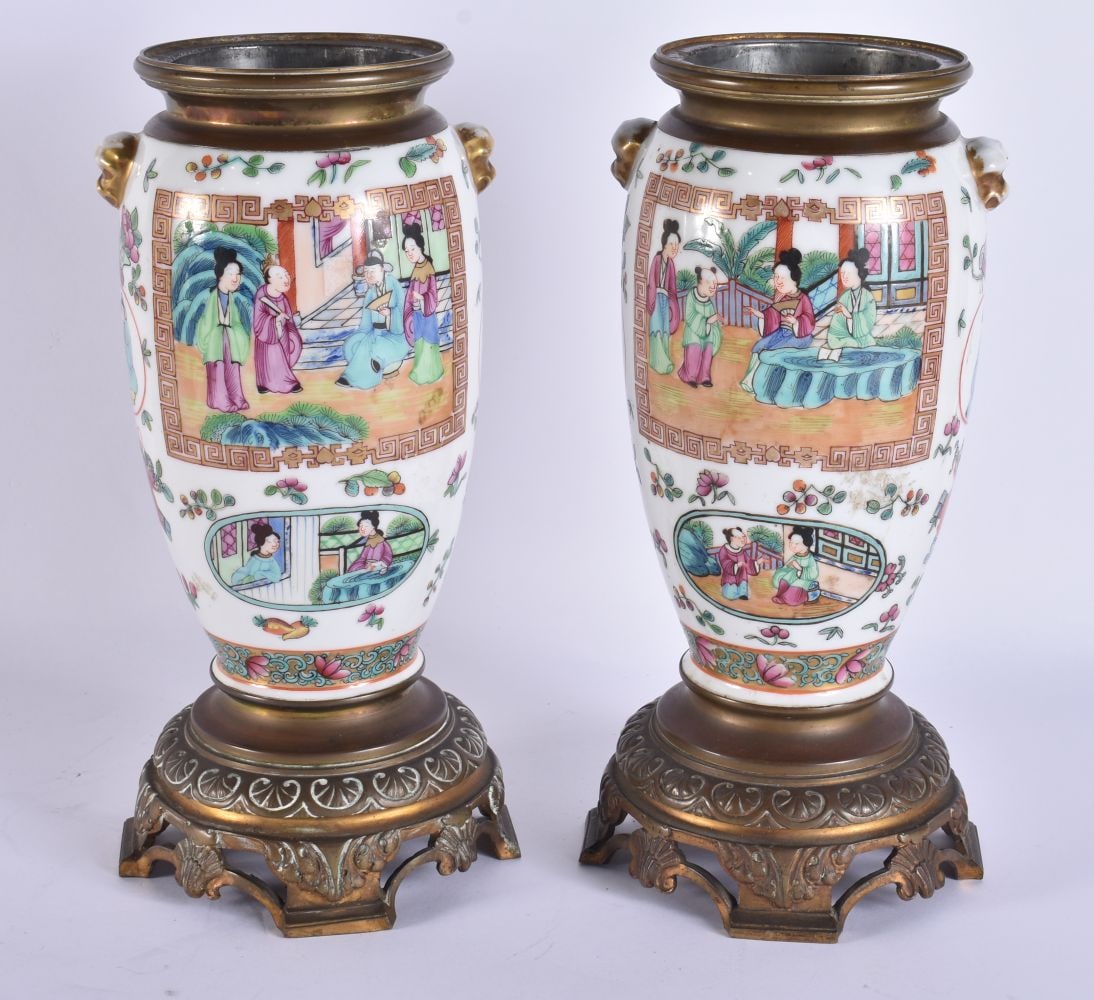 A PAIR OF ANTIQUE CHINESE CANTON FAMILLE ROSE BRONZE OIL LAMP BASES. 29 cm high.: A PAIR OF ANTIQUE CHINESE CANTON FAMILLE ROSE BRONZE OIL LAMP BASES. 29 cm high.
