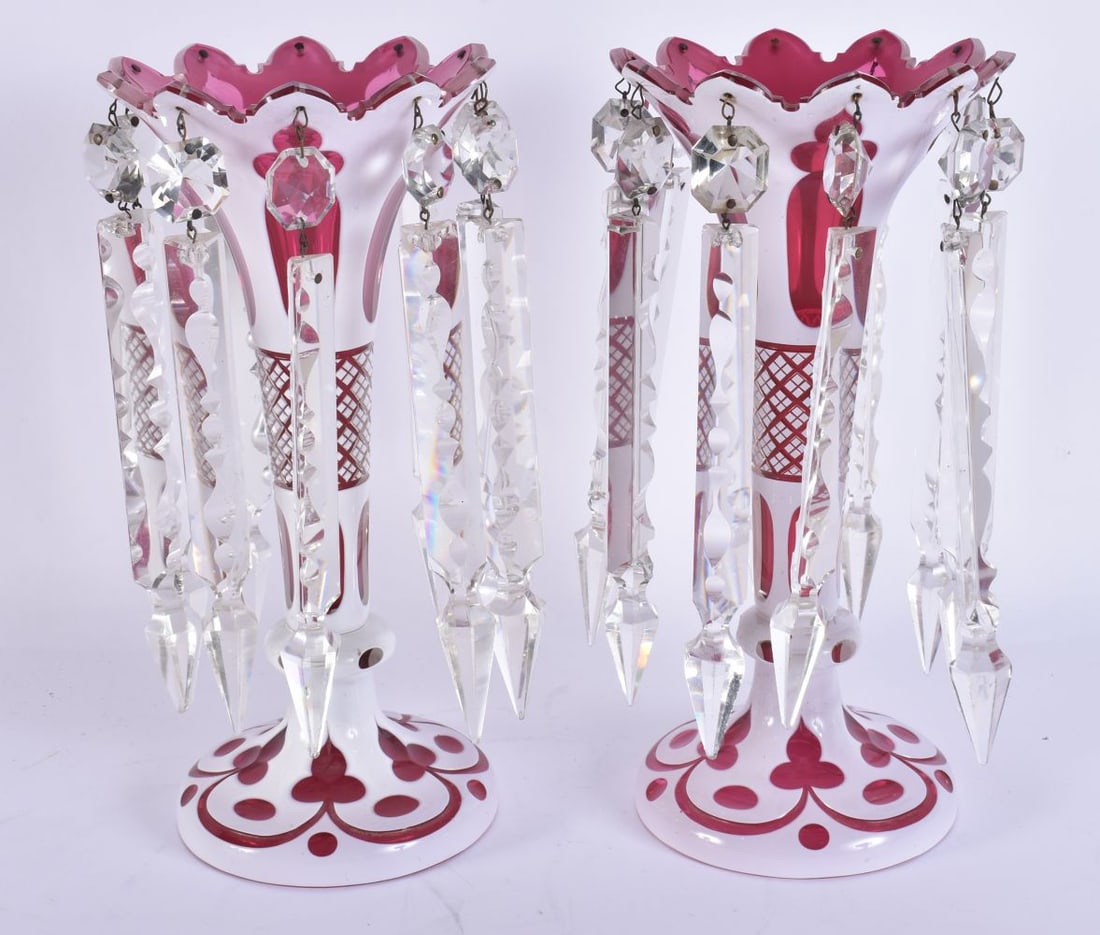 A PAIR OF ANTIQUE BOHEMIAN RUBY GLASS LUSTRES. 27cm high.: A PAIR OF ANTIQUE BOHEMIAN RUBY GLASS LUSTRES. 27cm high.