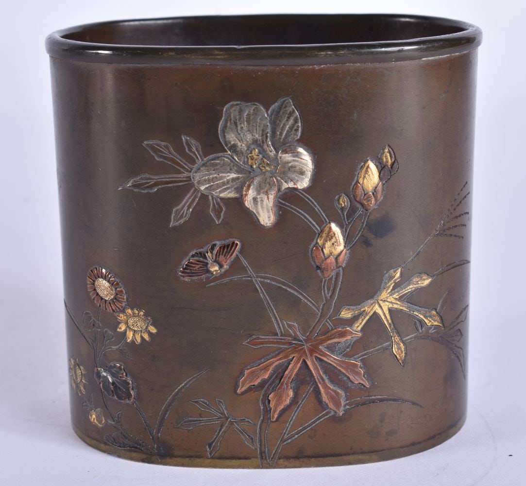 A 19TH CENTURY JAPANESE MEIJI PERIOD MIXED METAL BRONZE BRUSH POT decorated with insects and flowers: A 19TH CENTURY JAPANESE MEIJI PERIOD MIXED METAL BRONZE BRUSH POT decorated with insects and flowers. 7.5 cm x 8 cm.