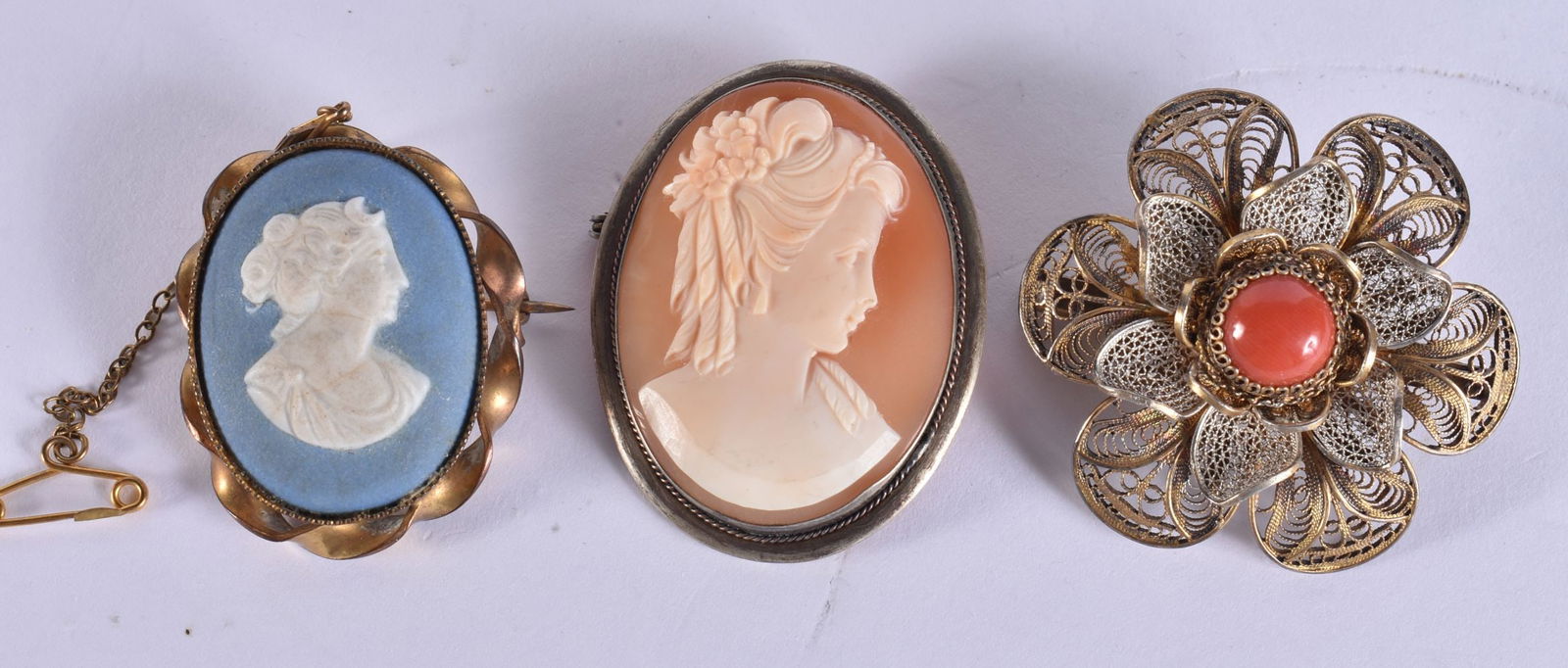 TWO CAMEO BROOCHES and another. (3) (1 of 4)