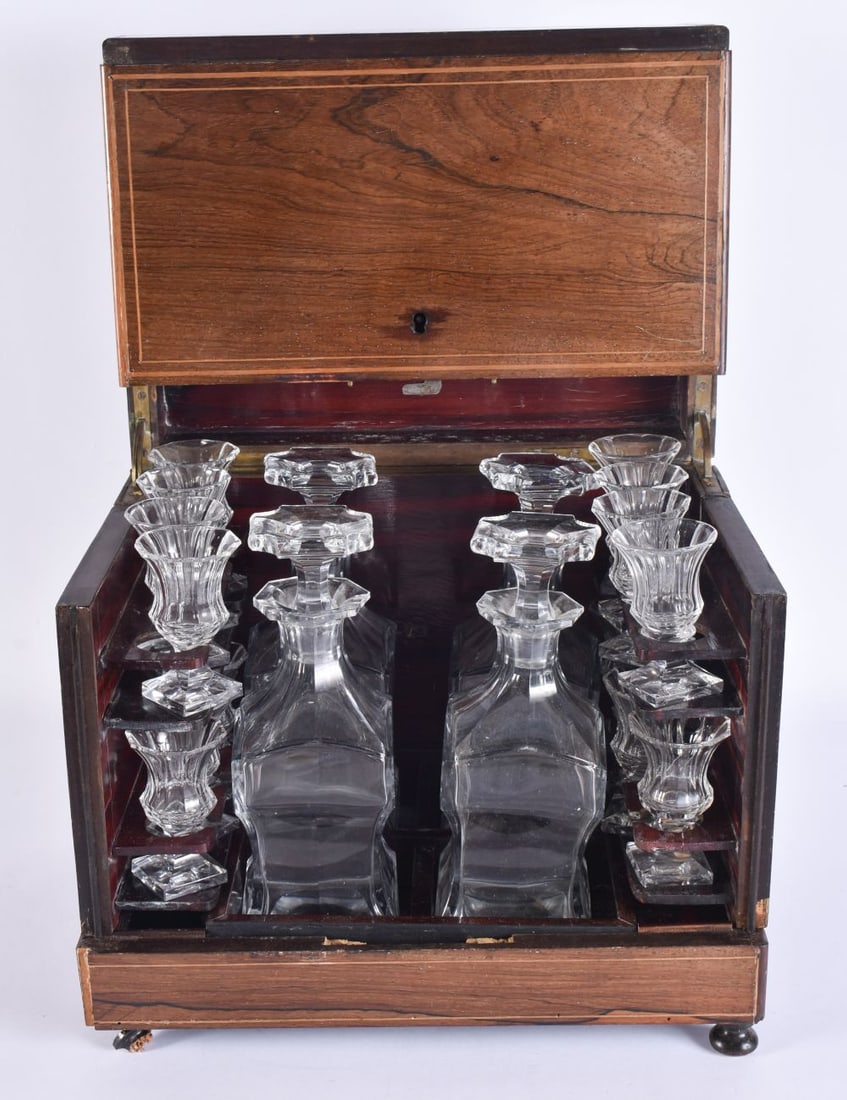 A VICTORIAN ROSEWOOD CASED GLASS LIQUOR DECANTER SET. 25 cm x 30 cm. (1 of 5)