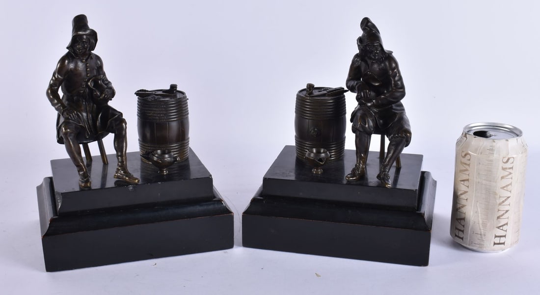 A PAIR OF 19TH CENTURY FRENCH BRONZE FIGURES modelled as males with a barrel and oil lamp. 23 cm x 1: A PAIR OF 19TH CENTURY FRENCH BRONZE FIGURES modelled as males with a barrel and oil lamp. 23 cm x 15 cm.