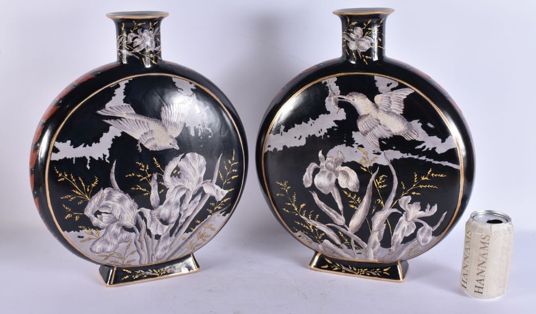 A LARGE PAIR OF CONTINENTAL POTTERY MOON FLASKS painted with birds and flowers. 38 cm x 25 cm.: A LARGE PAIR OF CONTINENTAL POTTERY MOON FLASKS painted with birds and flowers. 38 cm x 25 cm.