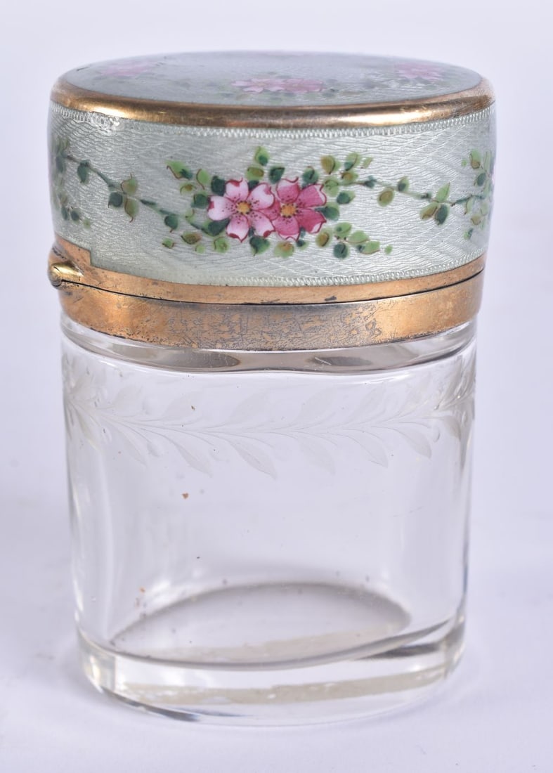 AN ANTIQUE EUROPEAN SILVER GILT AND ENAMEL GLASS SCENT BOTTLE painted with flowers. 7.5 cm x 5 cm.: AN ANTIQUE EUROPEAN SILVER GILT AND ENAMEL GLASS SCENT BOTTLE painted with flowers. 7.5 cm x 5 cm.
