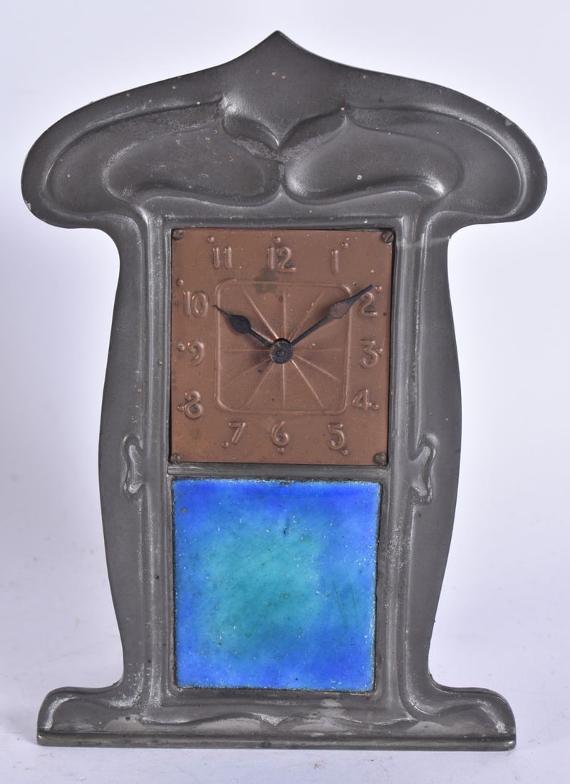 A LOVELY LIBERTY & CO TUDRIC PEWTER AND ENAMEL CLOCK. 17 cm x 10 cm.: A LOVELY LIBERTY & CO TUDRIC PEWTER AND ENAMEL CLOCK. 17 cm x 10 cm.